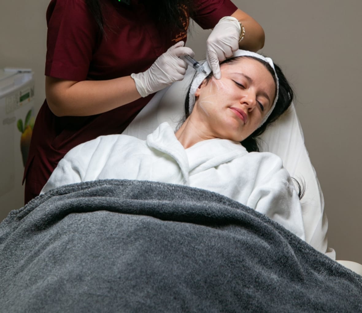 a girl taking botox treatment